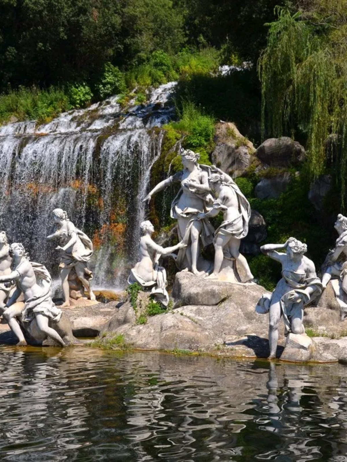 a group of people standing next to Palace of Caserta