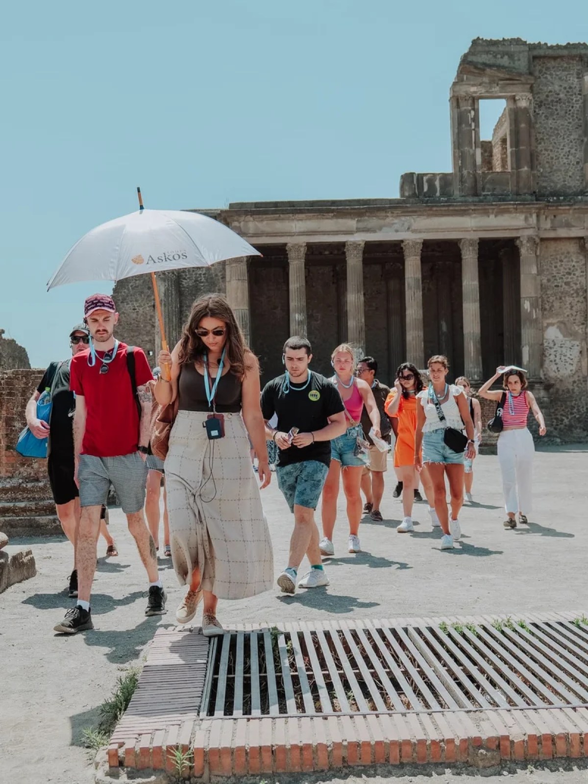 a group of people walking in front of a building