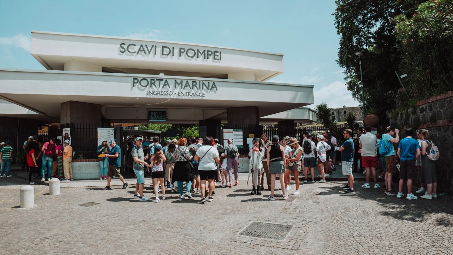 a group of people walking in front of a crowd
