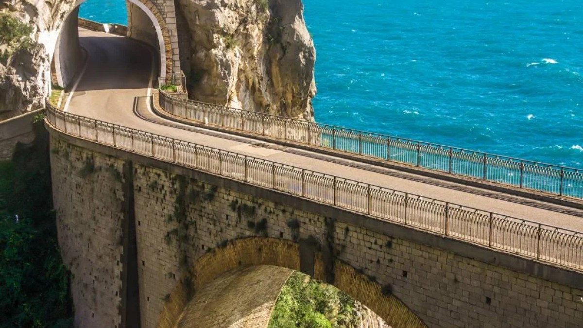 a stone bridge over a body of water