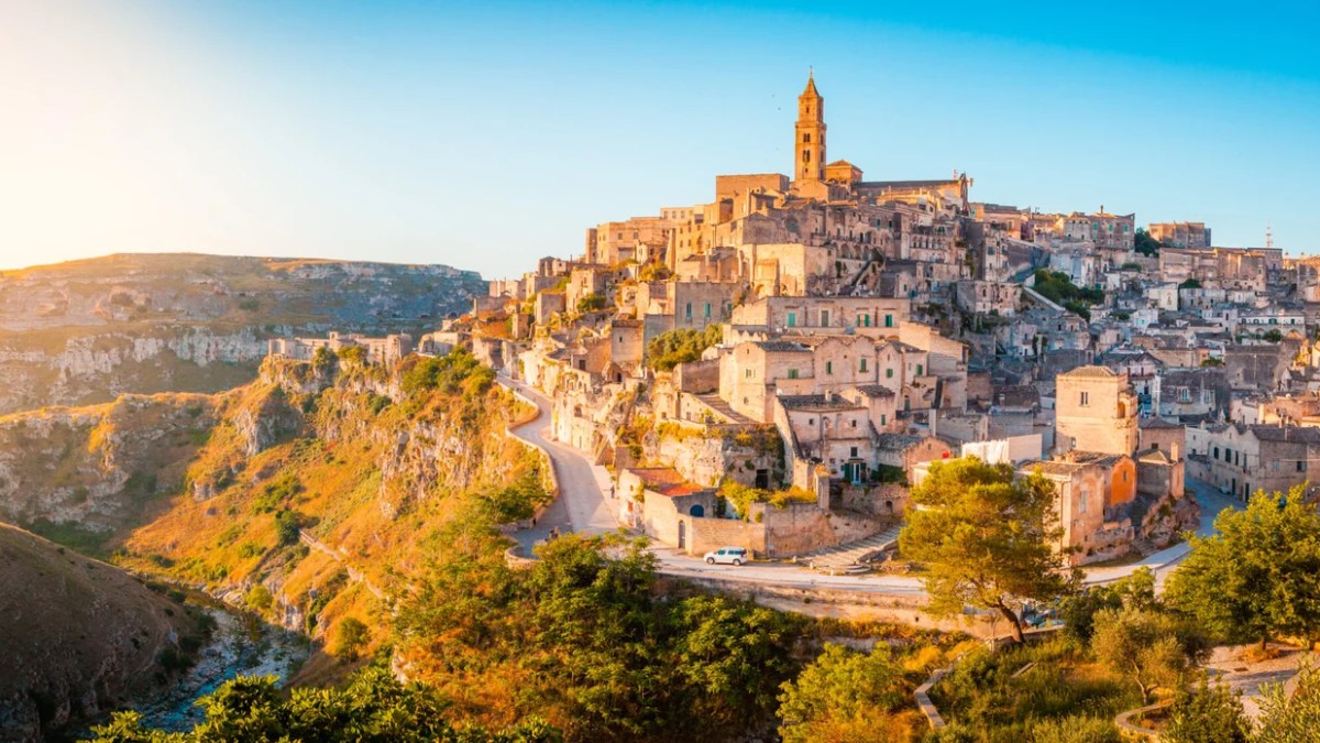 a canyon with Matera in the background