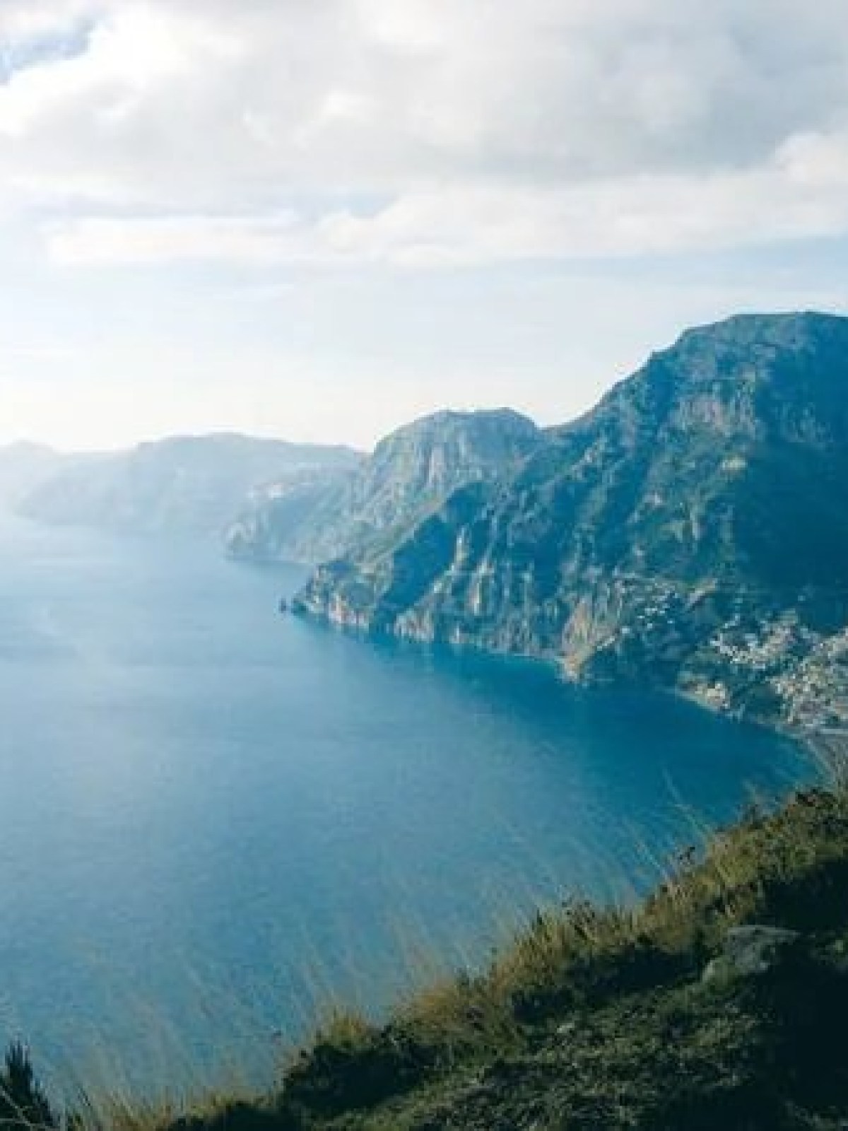 a view of a body of water with a mountain in the background