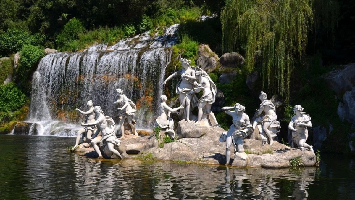 a group of people standing next to Palace of Caserta