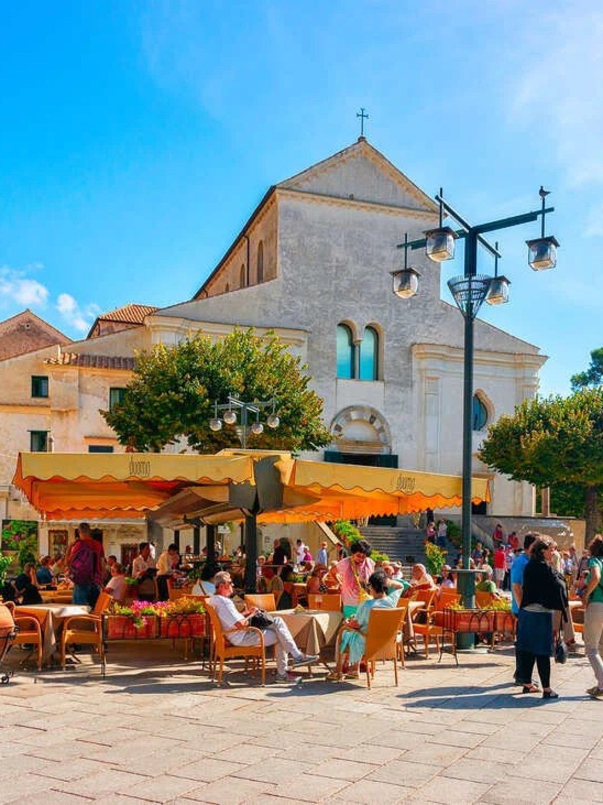 a group of people on a sidewalk