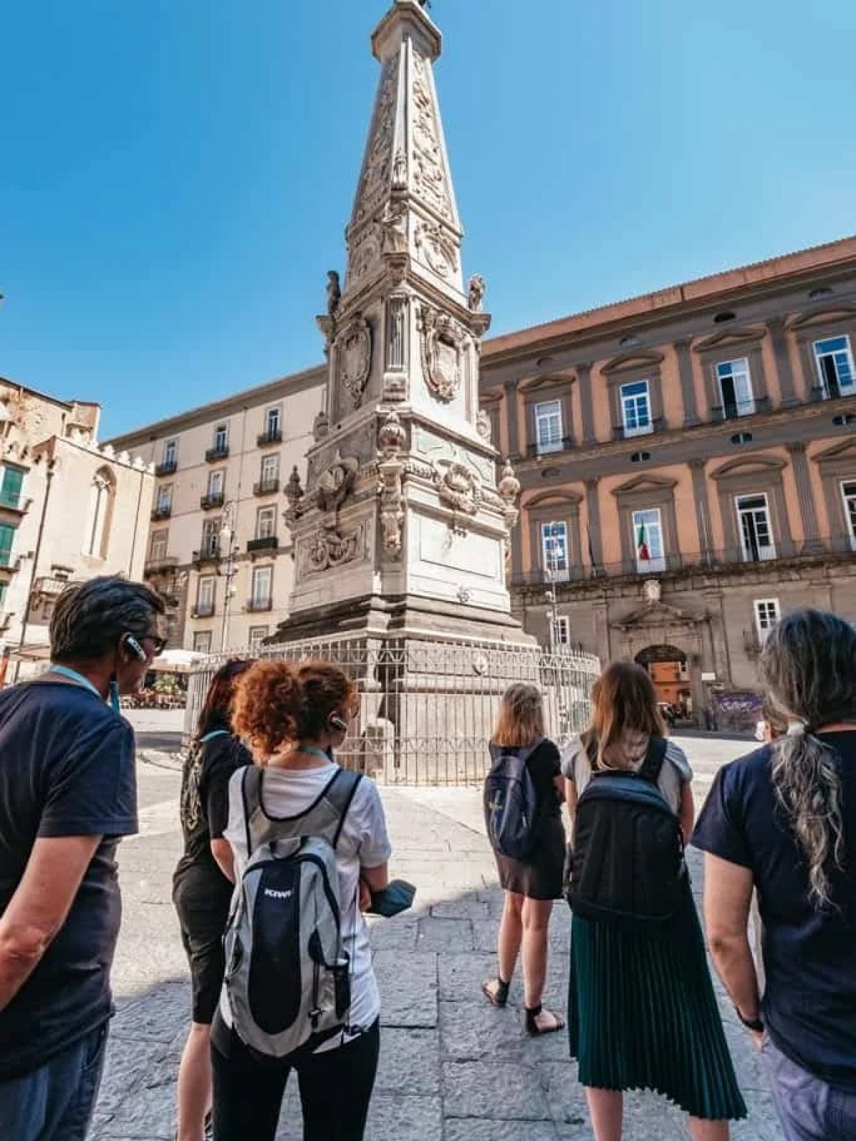 a group of people standing in front of a building