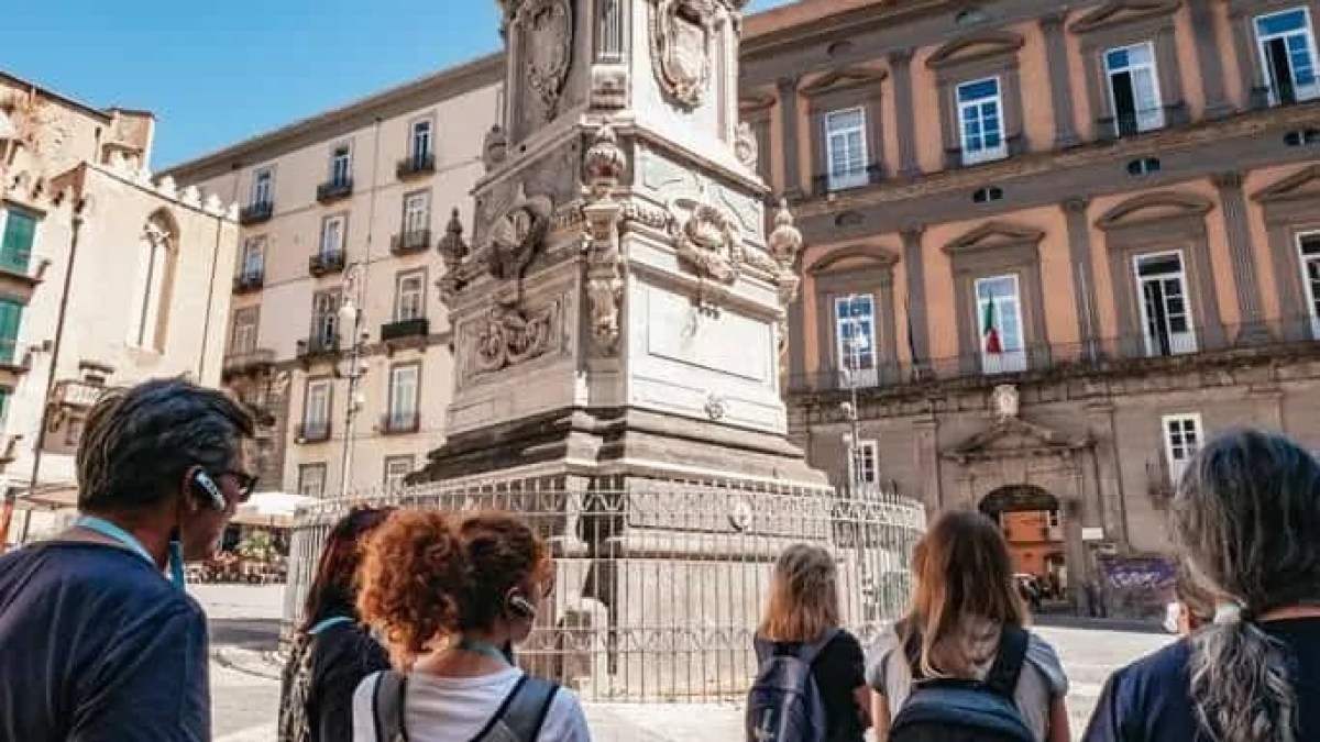 a group of people standing in front of a building