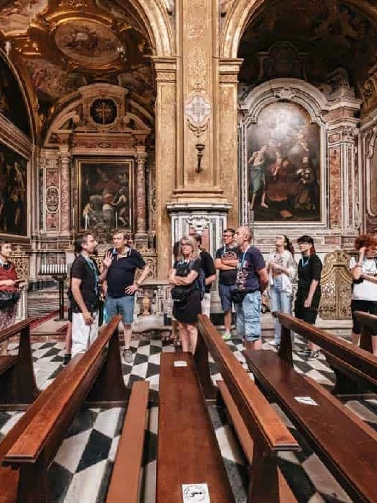 a group of people standing on top of a wooden bench