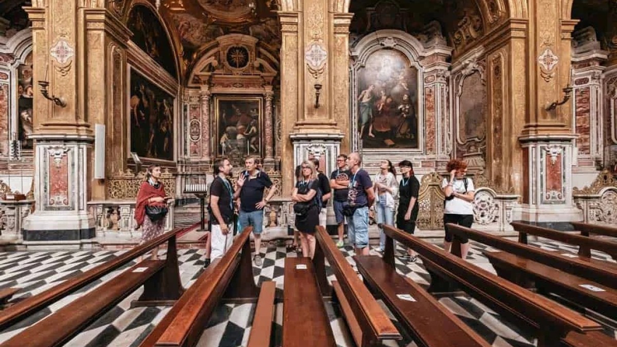 a group of people standing on top of a wooden bench