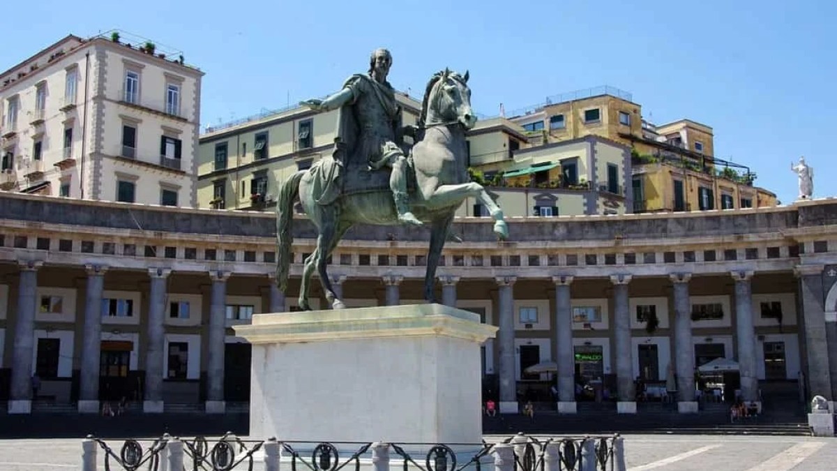 a statue in front of a building