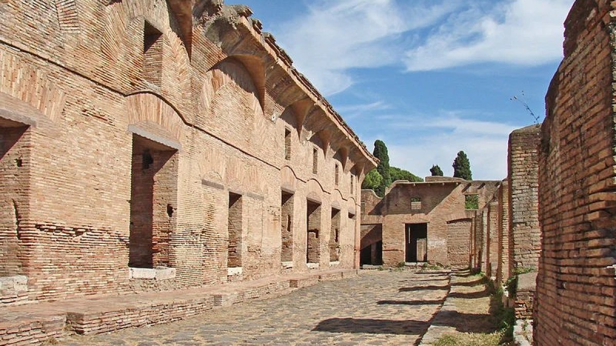 a stone castle next to a brick building