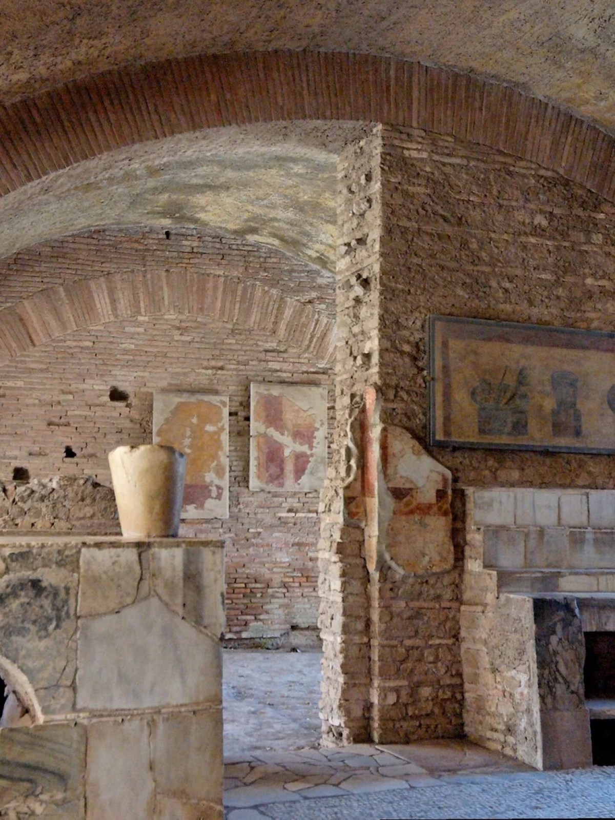a fire place sitting in a room with a stone fireplace