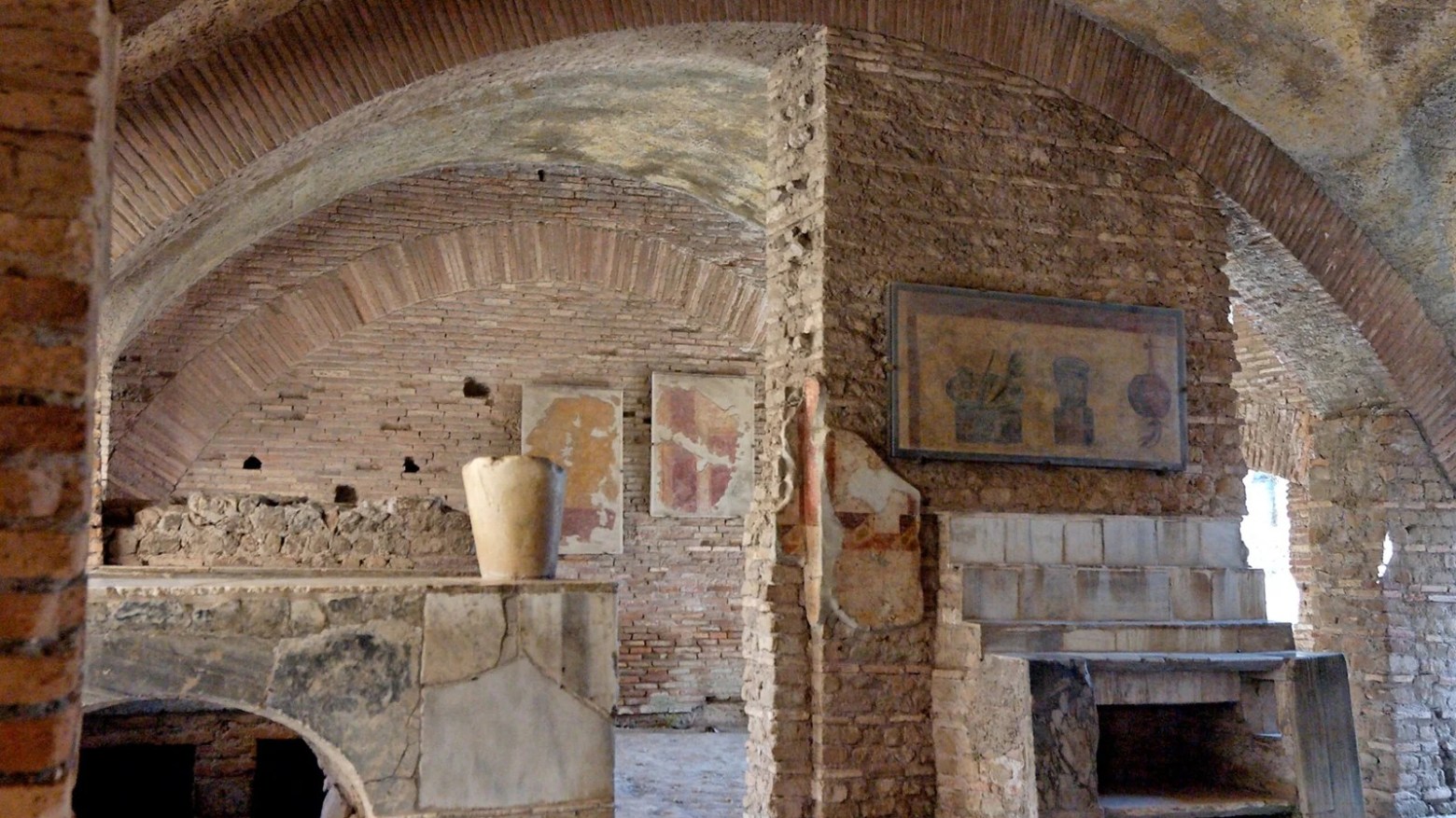 a fire place sitting in a room with a stone fireplace