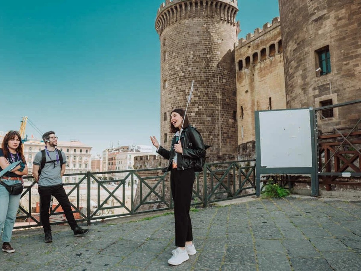a group of people standing in front of a building
