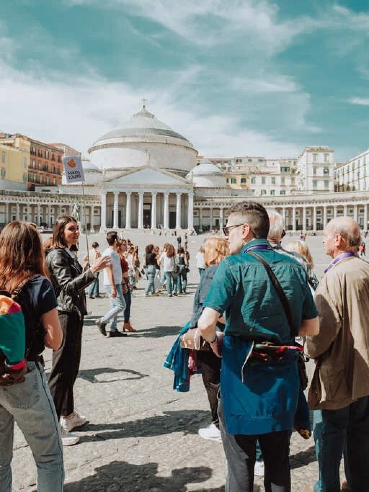 a group of people walking down the street