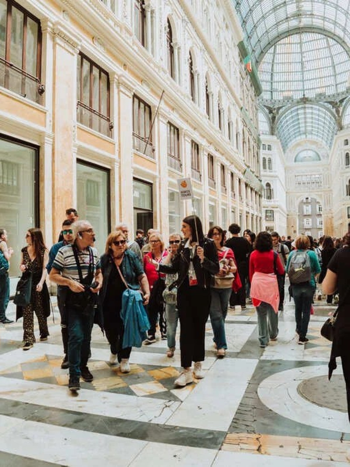 a group of people walking down the street