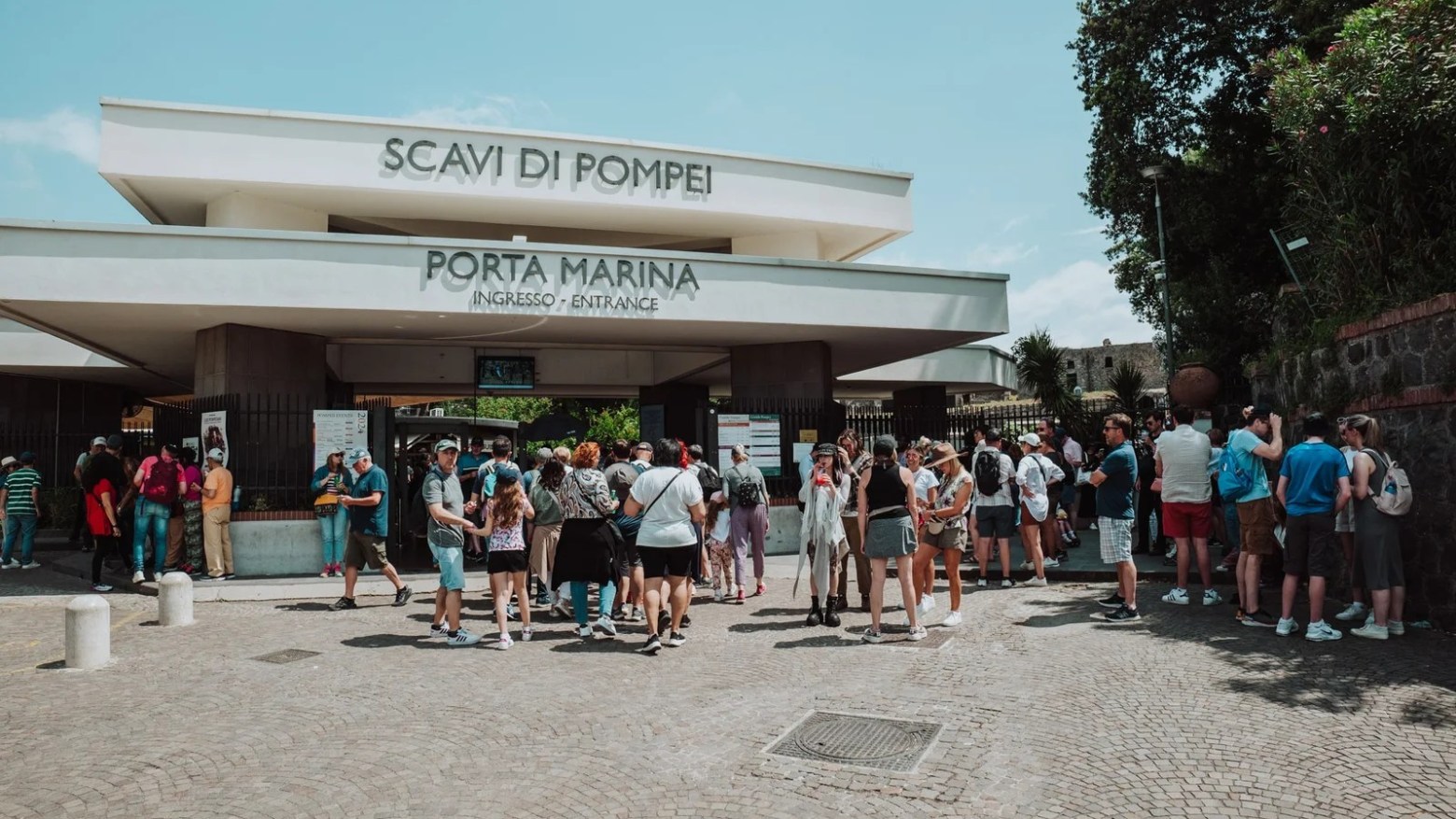 a group of people walking in front of a crowd