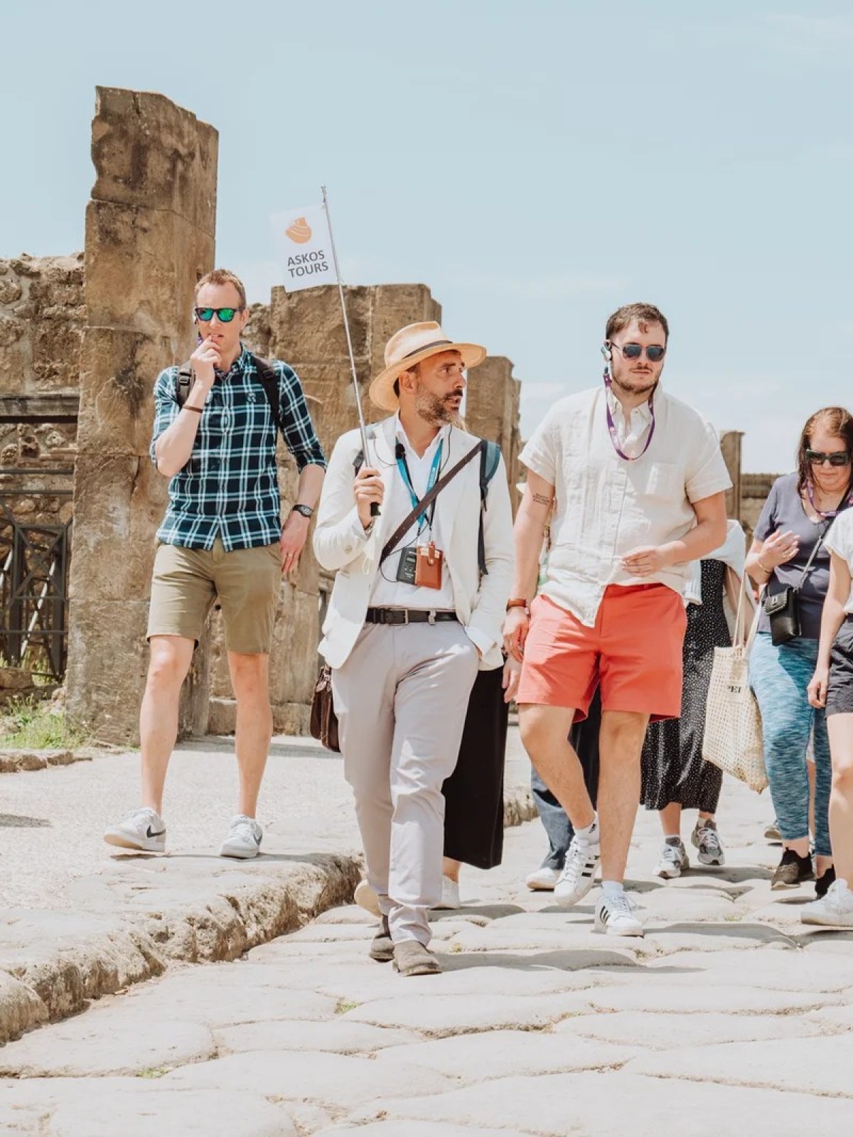 a group of people that are standing in the sand