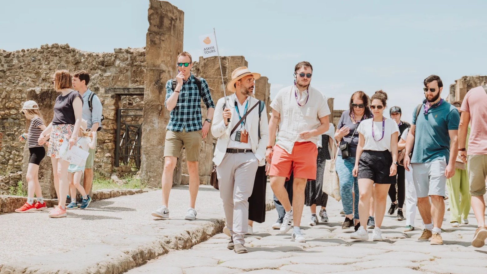 a group of people that are standing in the sand