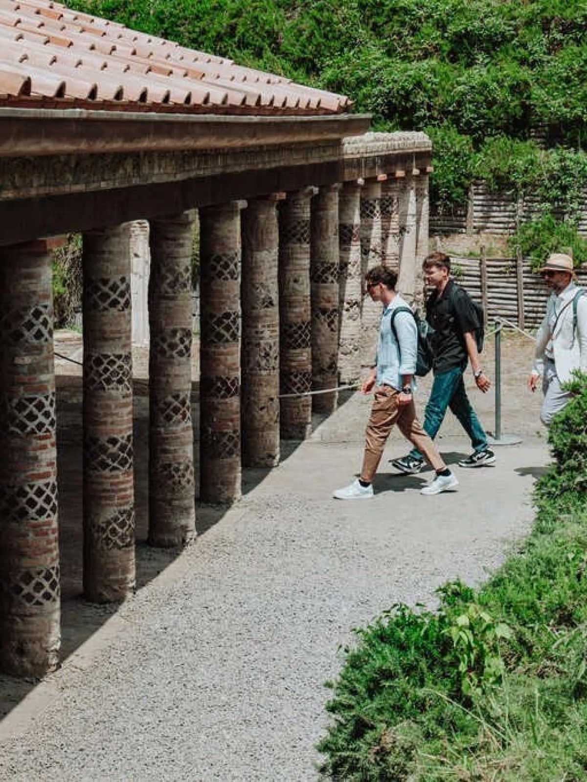 a group of people walking on a bridge
