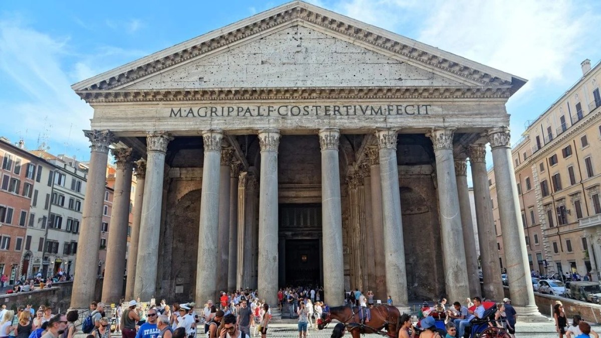a group of people walking in front of Pantheon, Rome