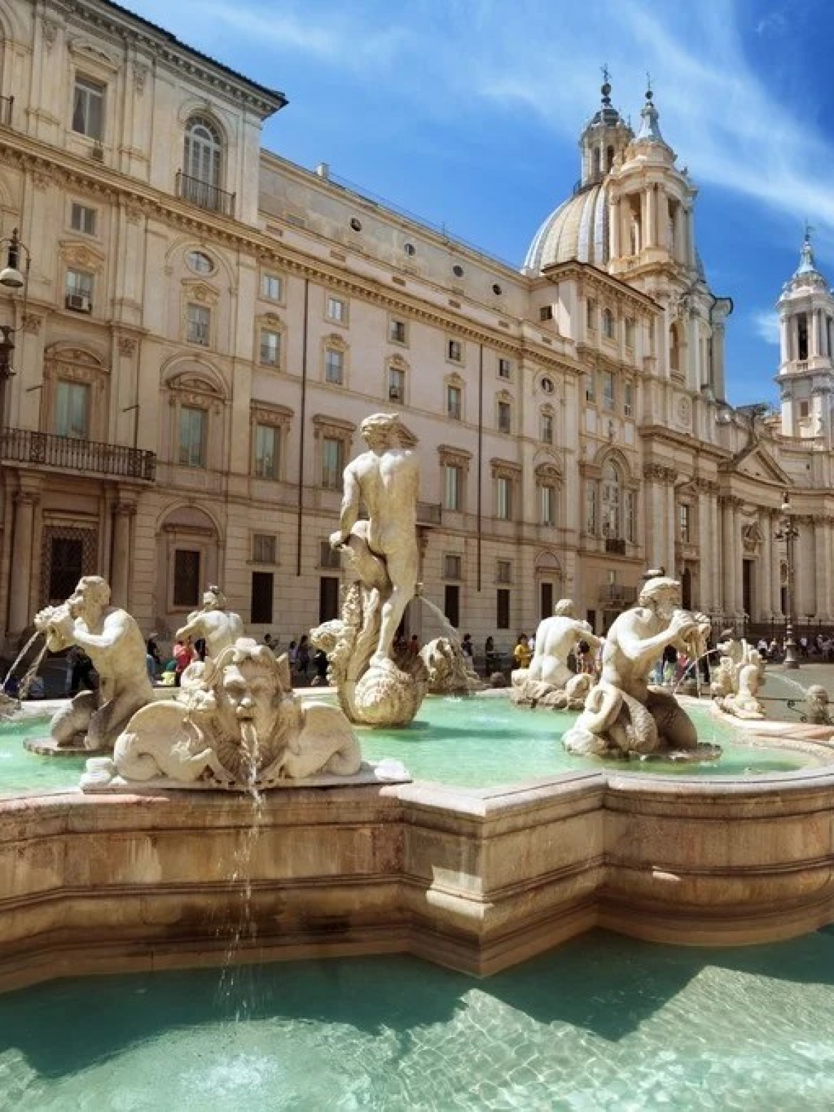 a statue in front of Piazza Navona
