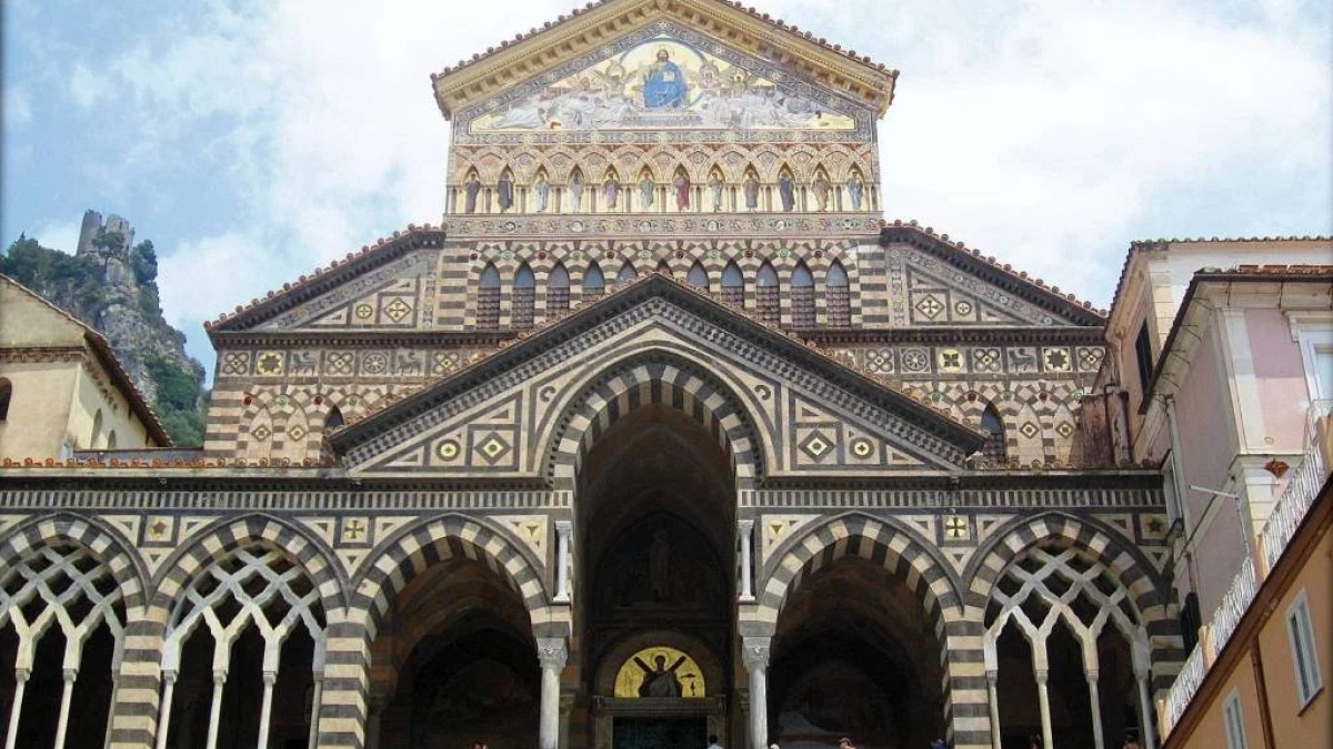 a group of people standing in front of Amalfi