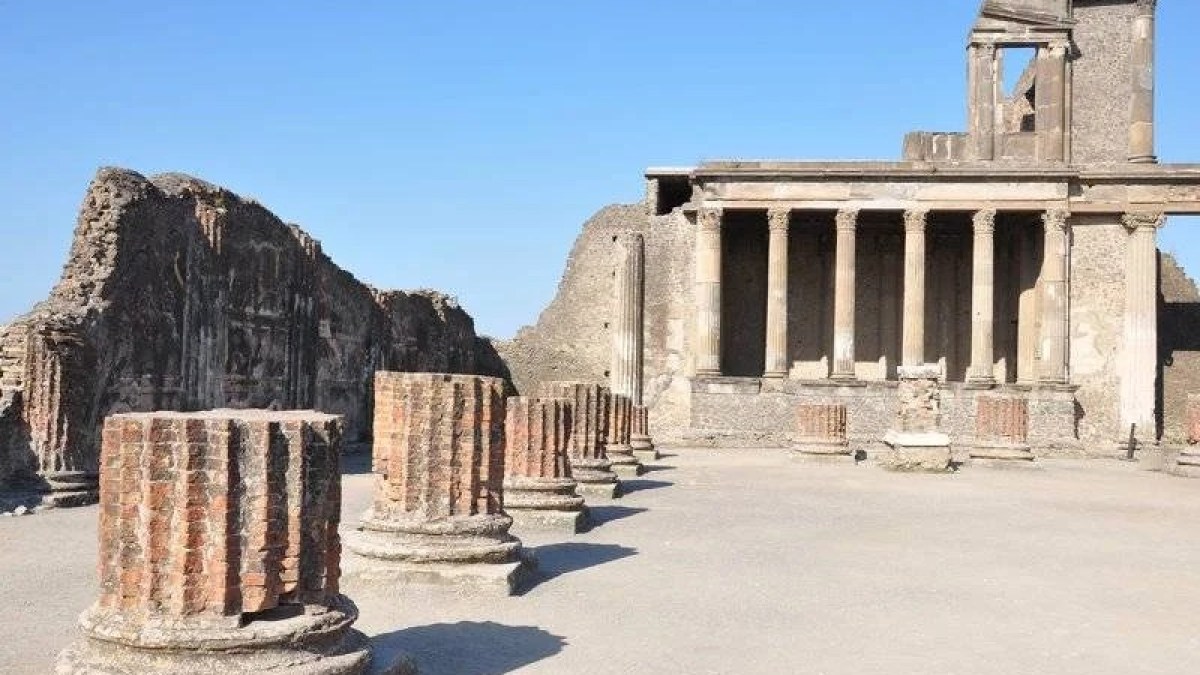 a large stone statue in front of a building