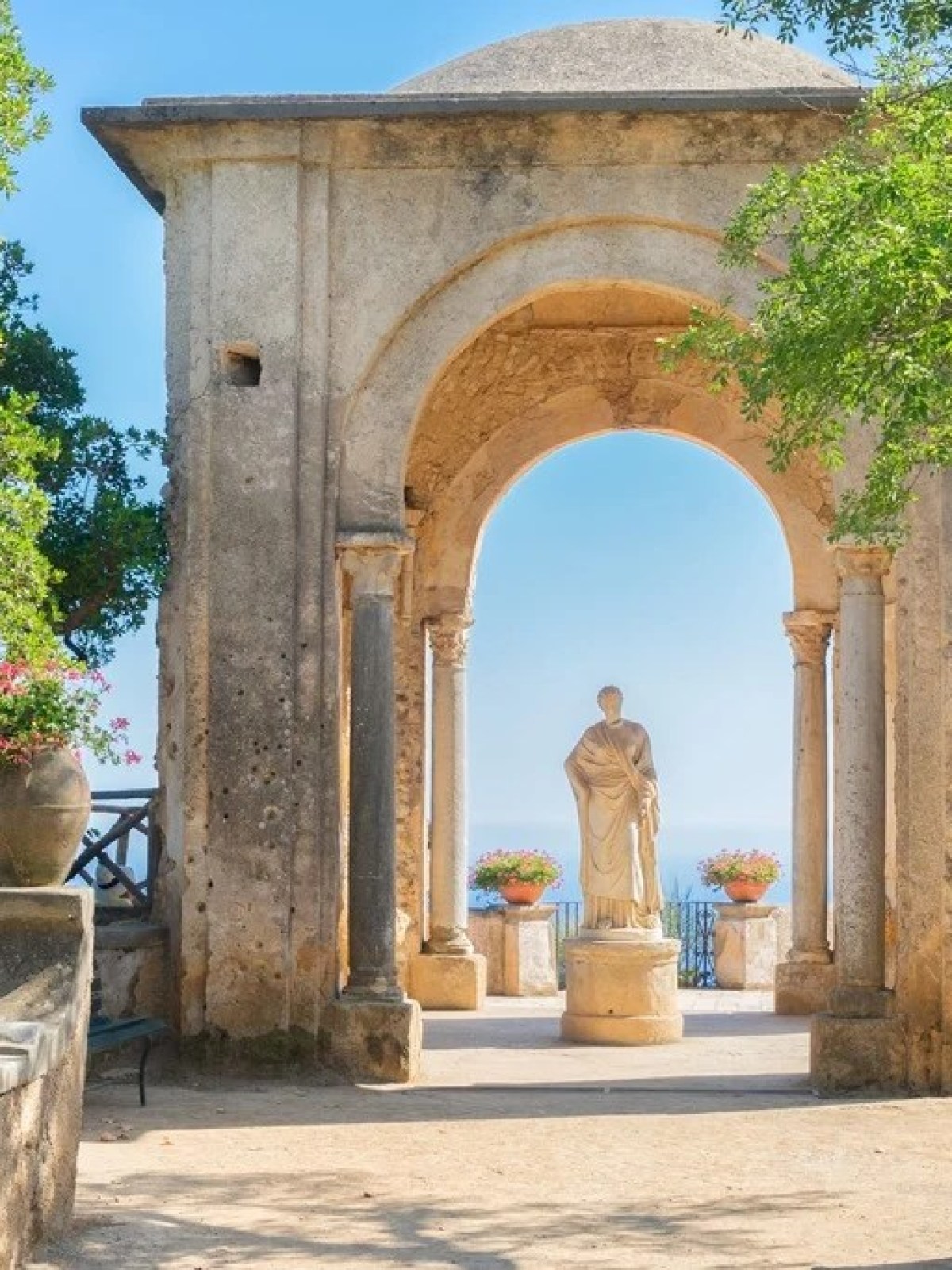 a large stone statue in front of a building