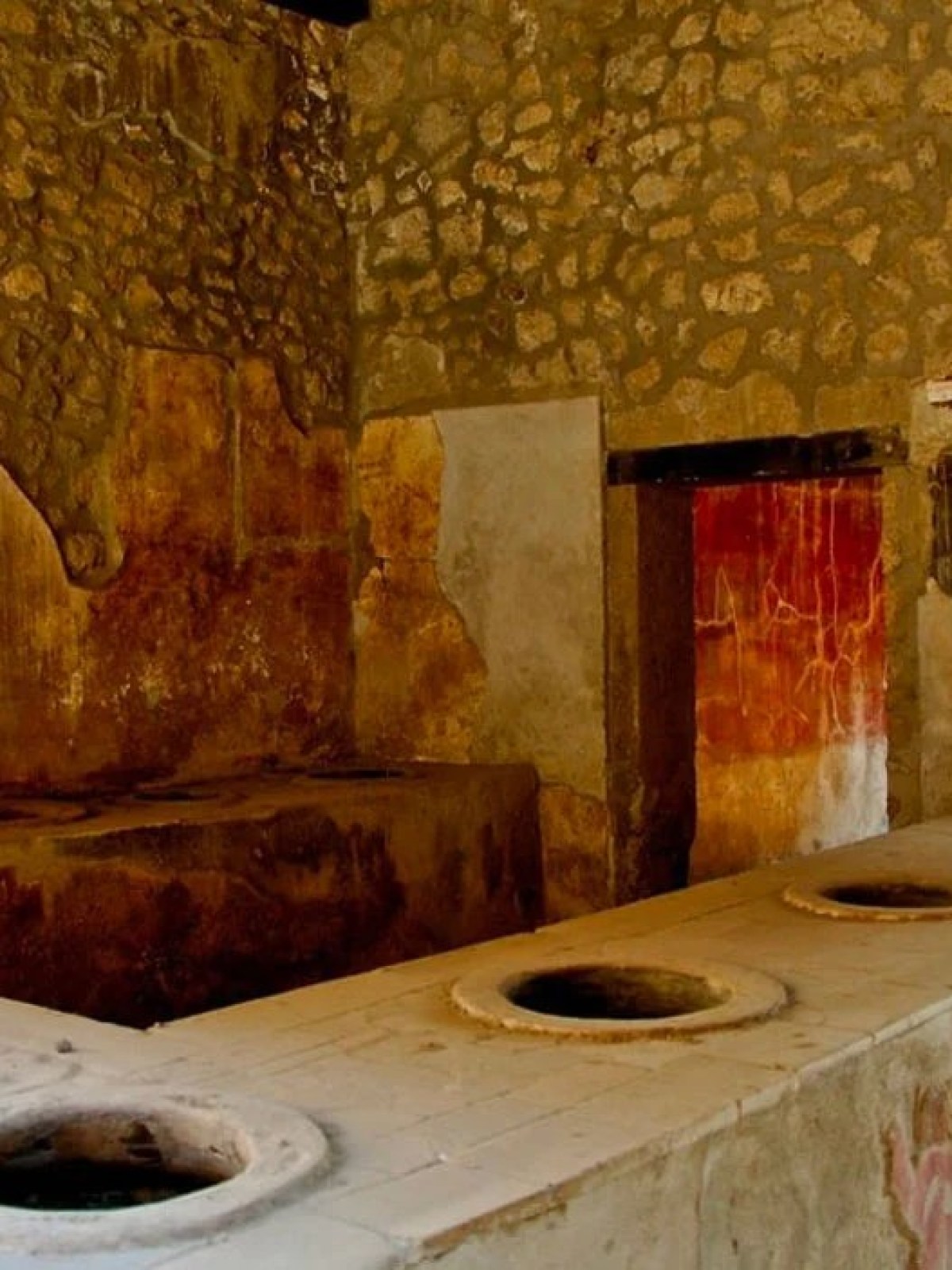 a stone oven next to a sink