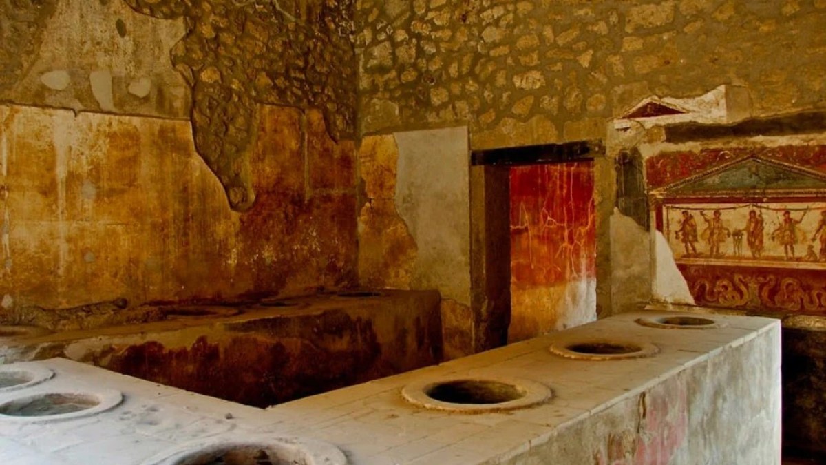 a stone oven next to a sink