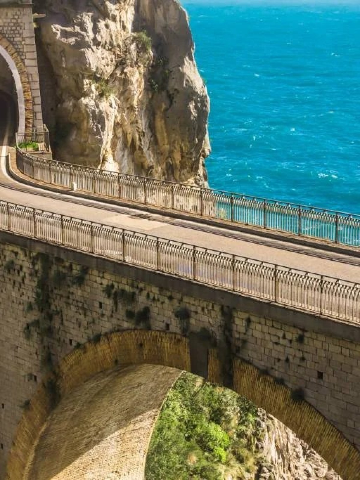 a stone bridge over a body of water
