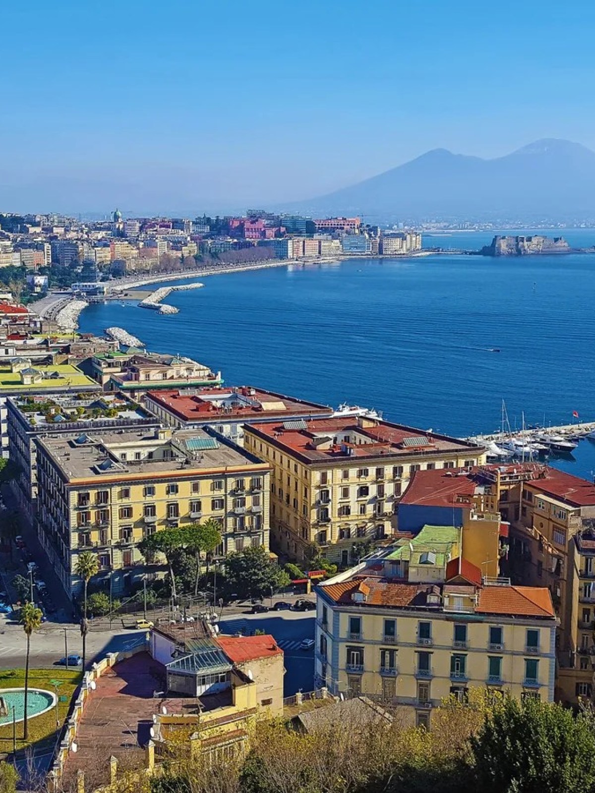 a view of a large body of water with a city in the background