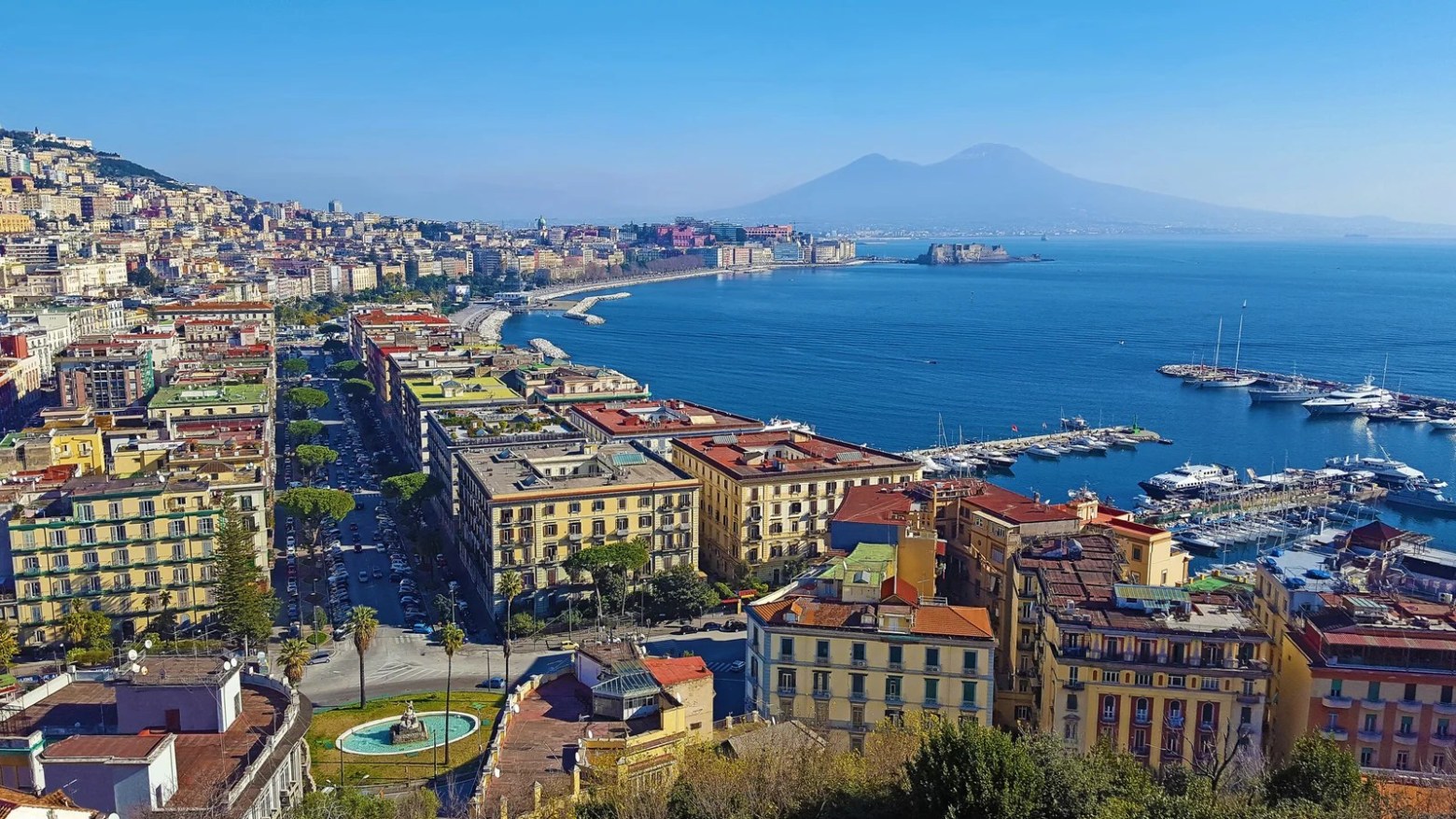 a view of a large body of water with a city in the background