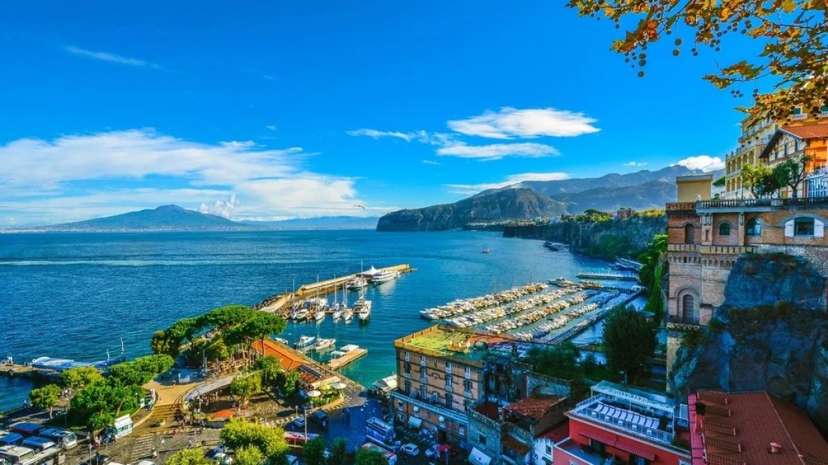 a large body of water with a city in the background