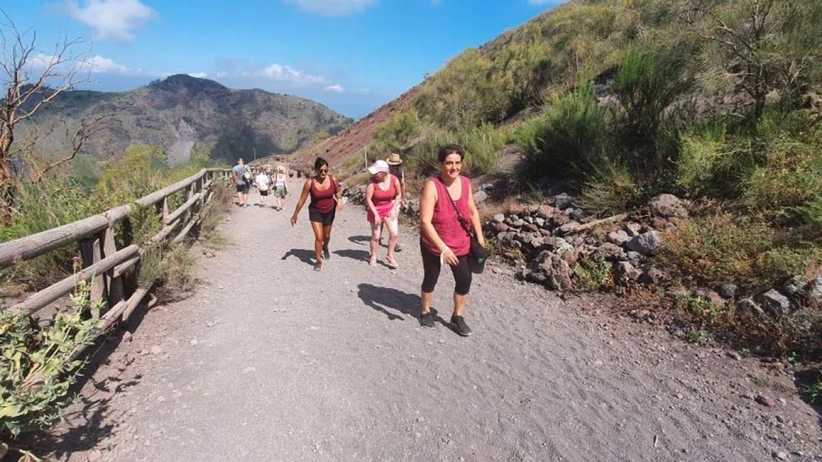 a man walking down a dirt road