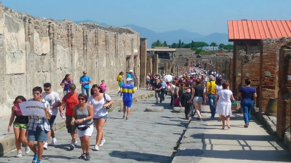 a group of people walking in front of a building