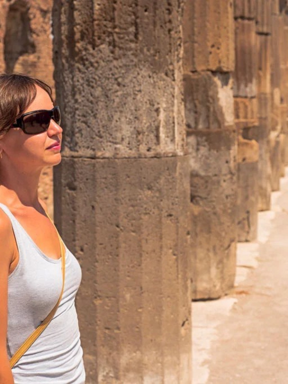 a woman standing in front of a building