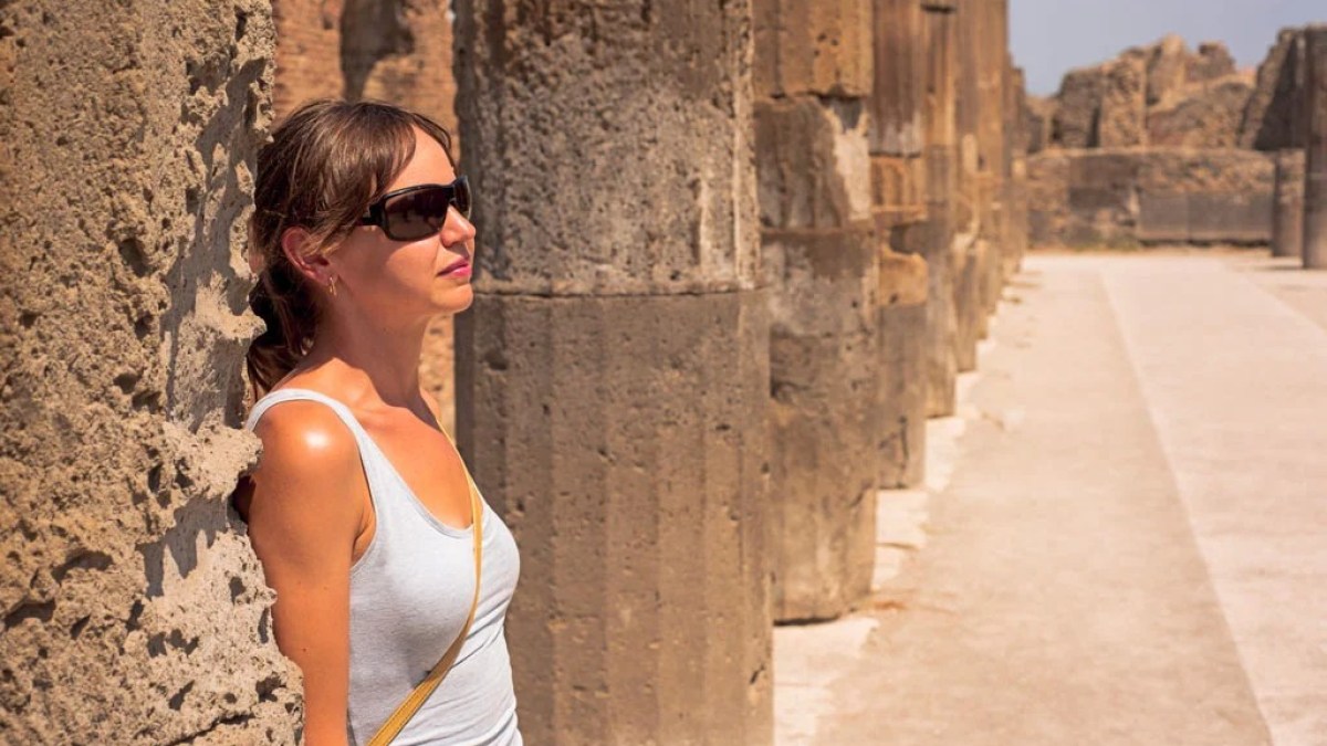 a woman standing in front of a building