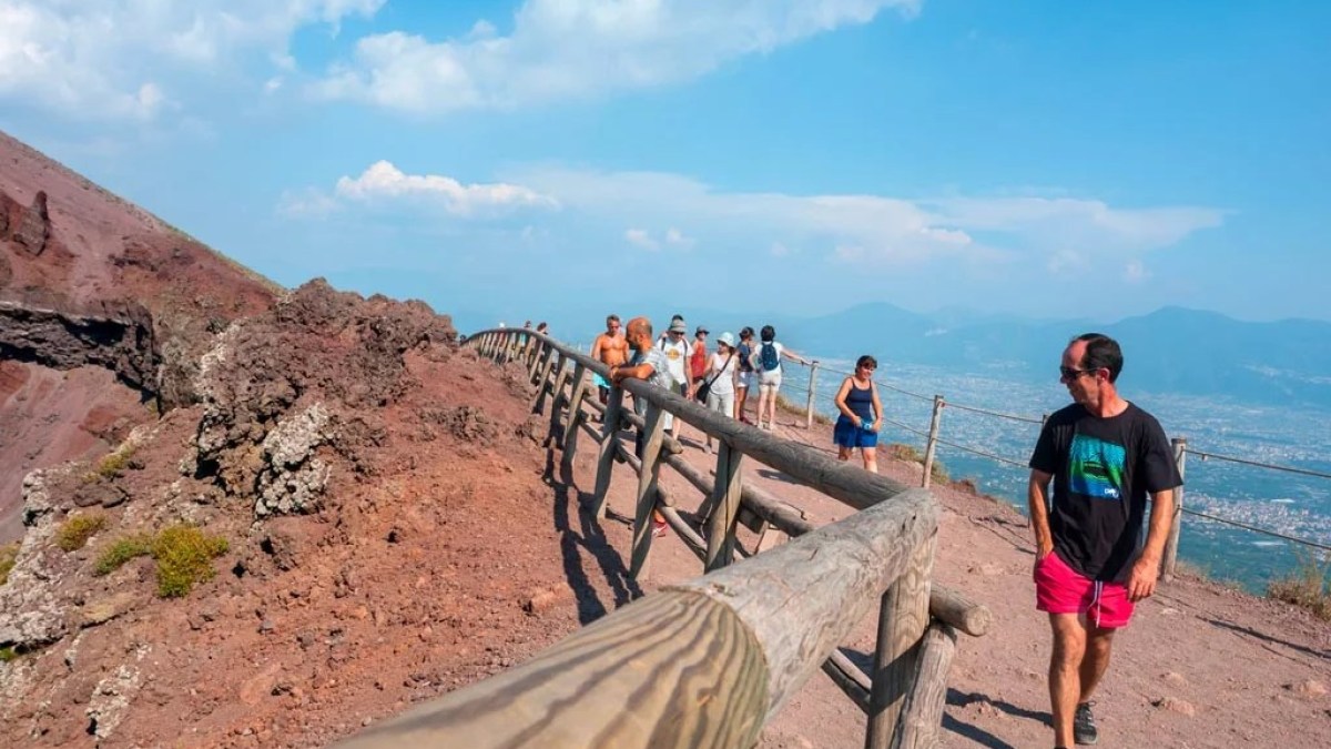 a man standing on a rocky beach