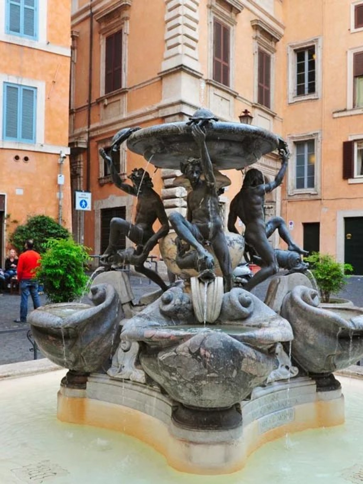 a statue in front of a building