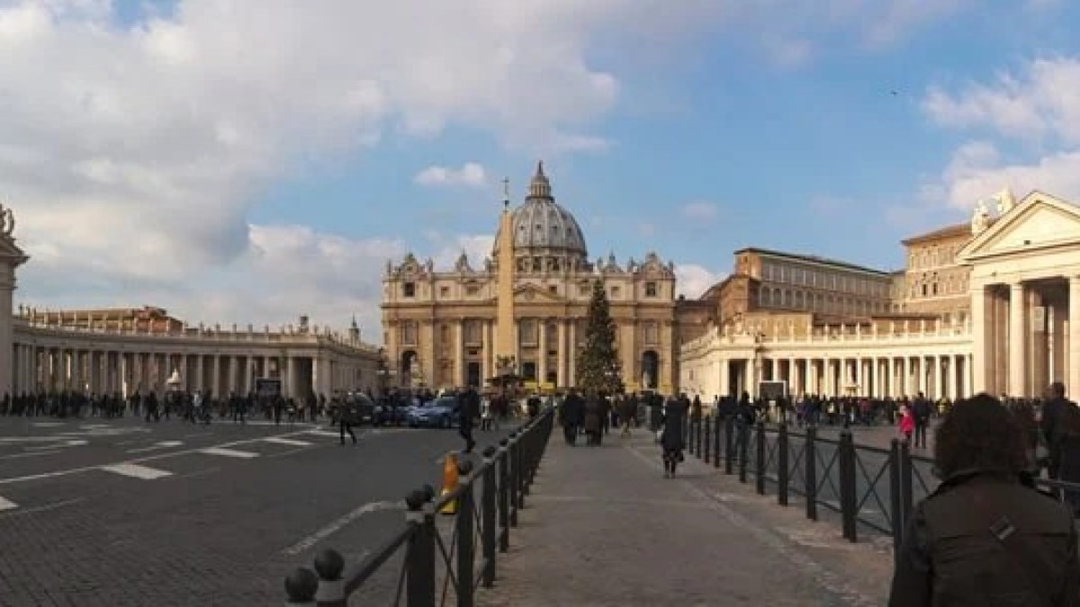 a group of people walking in front of a building